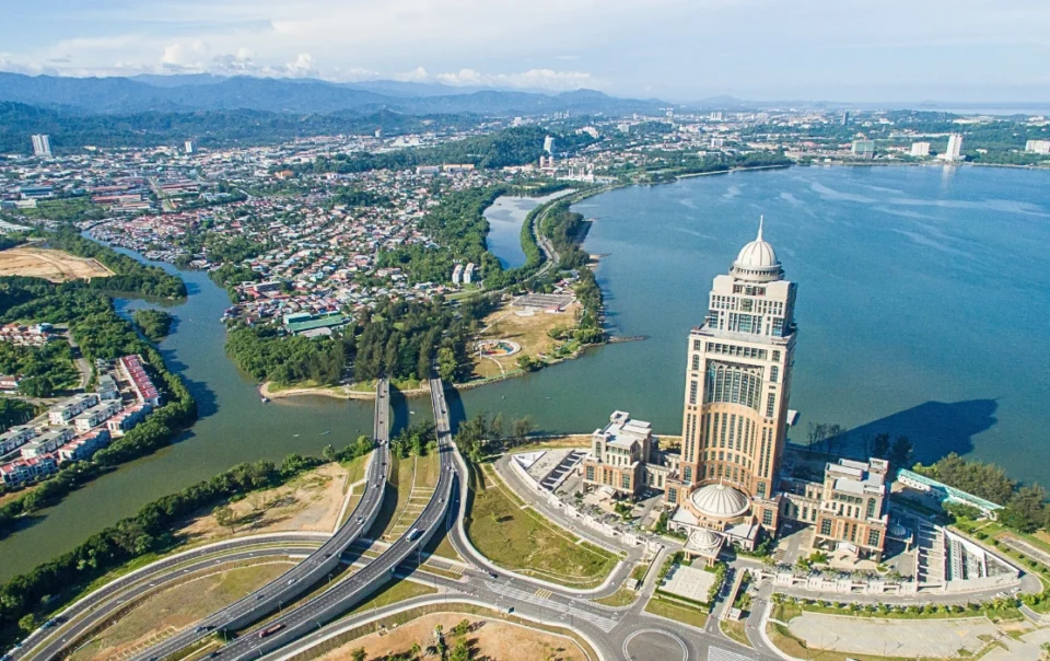Aerial view of Kota Kinabalu city centre and surrounding landscape- feature image for Kota Kinabalu Travel Guide Blog