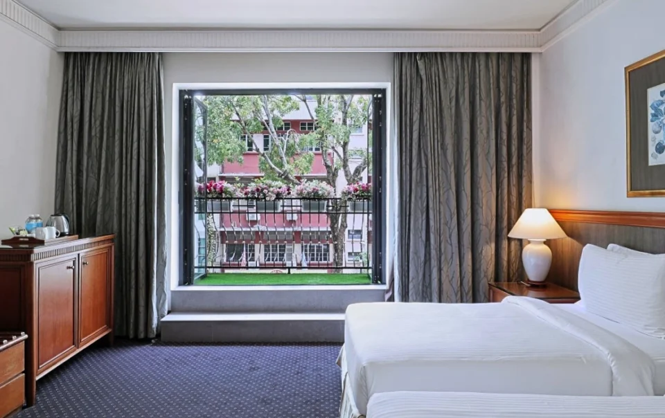 Deluxe Twin Bed room with balcony at The Jesselton Hotel Kota Kinabalu